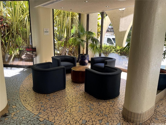 common area featuring a textured wall