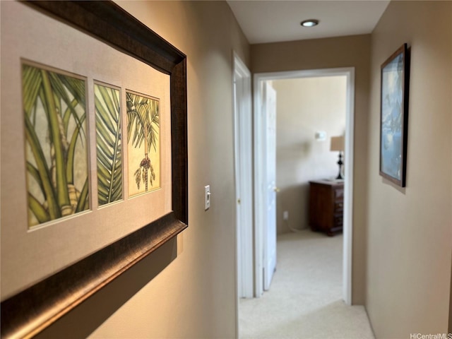 hall featuring light carpet