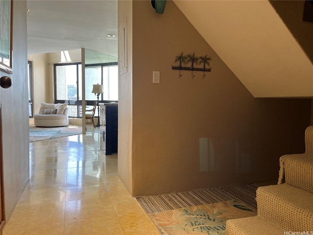 corridor with light tile patterned flooring