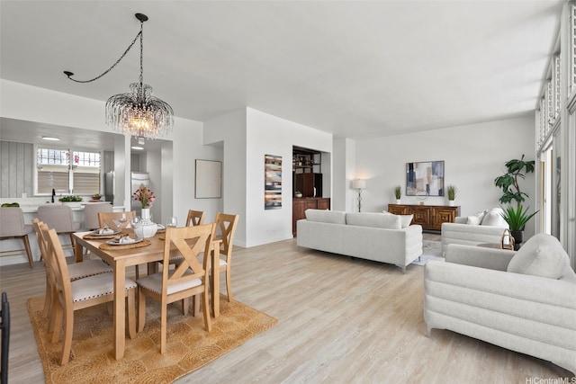 500 University Ave Unit Ph6, Honolulu, HI 96826 - dining room with a chandelier, light wood finished floors, and baseboards