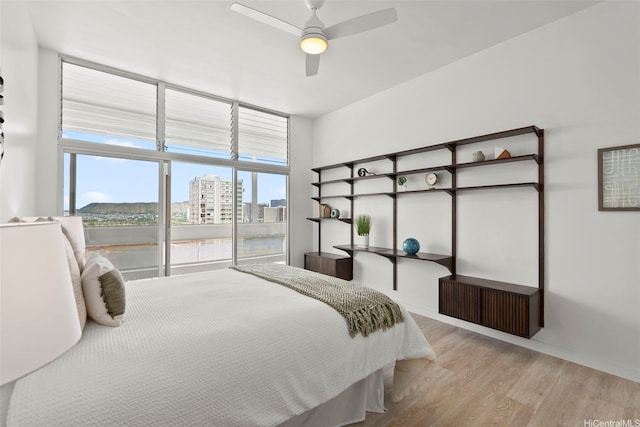 500 University Ave Unit Ph6, Honolulu, HI 96826 - bedroom featuring wood finished floors, baseboards, ceiling fan, and a view of city