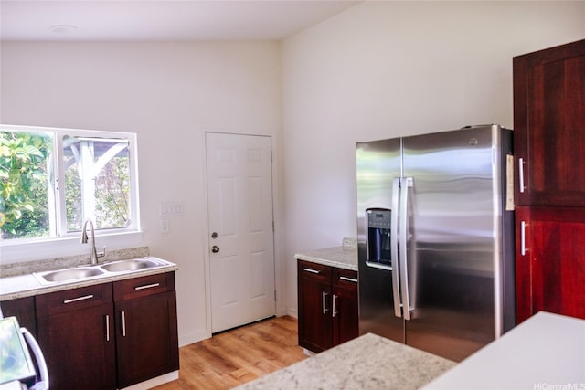 87-1026 Nenewai St, Waianae, HI 96792 - kitchen featuring stainless steel refrigerator with ice dispenser, light wood finished floors, range, and a towering ceiling