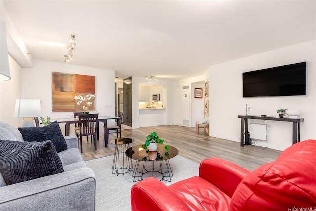 425 S St Unit 403, Honolulu, HI 96813 - living room with wood finished floors, rail lighting, and baseboards