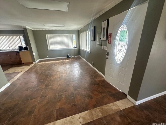 94-065 Waipahu Depot St Unit F, Waipahu, HI 96797 - entrance foyer featuring baseboards and crown molding