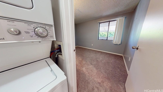 washroom featuring stacked washer and clothes dryer, carpet flooring, a textured ceiling, and baseboards