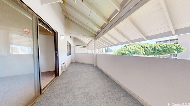 view of patio featuring a balcony