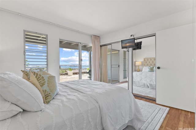 98-533 Kipaepae St Unit 104, Aiea, HI 96701 - bedroom with access to exterior and wood finished floors