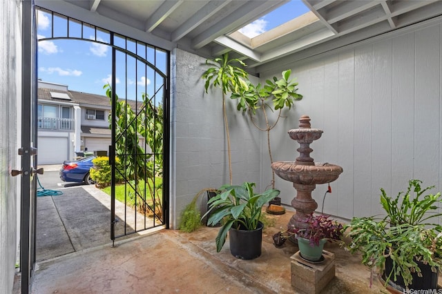 98-533 Kipaepae St Unit 104, Aiea, HI 96701 - doorway to outside featuring concrete floors and a skylight