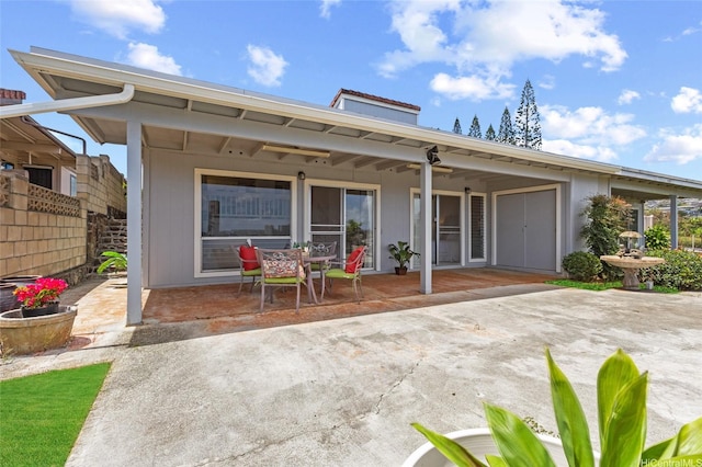 98-533 Kipaepae St Unit 104, Aiea, HI 96701 - rear view of house with a patio and fence