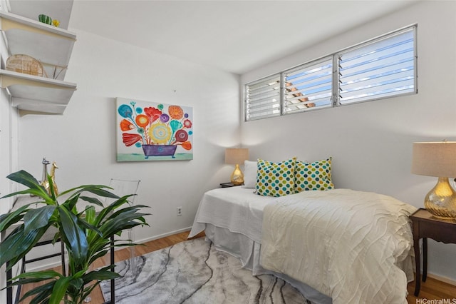 98-533 Kipaepae St Unit 104, Aiea, HI 96701 - bedroom with wood finished floors and baseboards