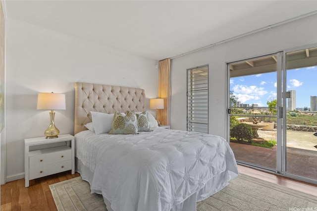 98-533 Kipaepae St Unit 104, Aiea, HI 96701 - bedroom with access to exterior and wood finished floors