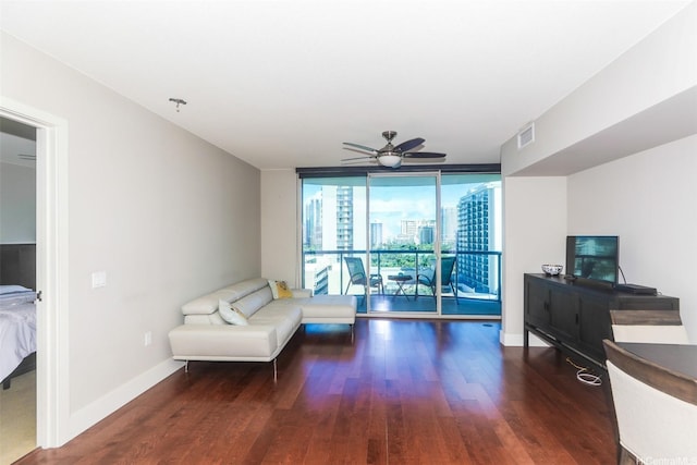 1837 Kalakaua Ave Unit 1102, Honolulu, HI 96815 - living area with wood finished floors, ceiling fan, baseboards, and a wall of windows