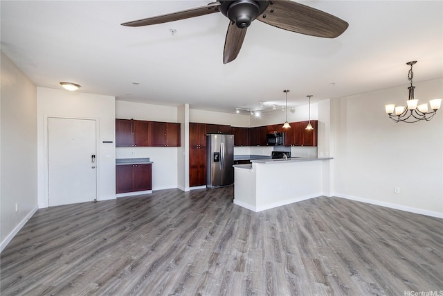 1020 Kakala St Unit 914, Kapolei, HI 96707 - kitchen featuring stainless steel fridge, black microwave, open floor plan, and wood finished floors