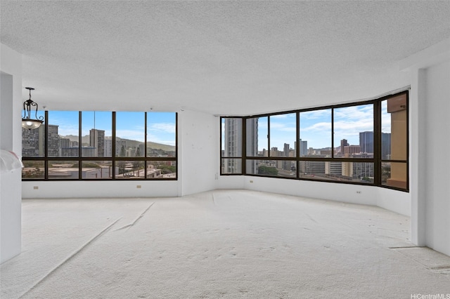 1040 Lunalilo St Unit 706, Honolulu, HI 96822 - empty room with a view of skyline, carpet flooring, and a textured ceiling