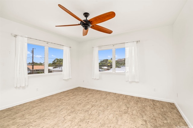 622 Pamaele St, Kailua, HI 96734 - unfurnished room with plenty of natural light, baseboards, a ceiling fan, and light floors