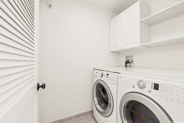 622 Pamaele St, Kailua, HI 96734 - laundry area featuring cabinet space, washing machine and clothes dryer, light tile patterned floors, and baseboards