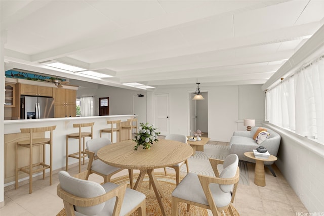 622 Pamaele St, Kailua, HI 96734 - dining space featuring light tile patterned floors and beamed ceiling