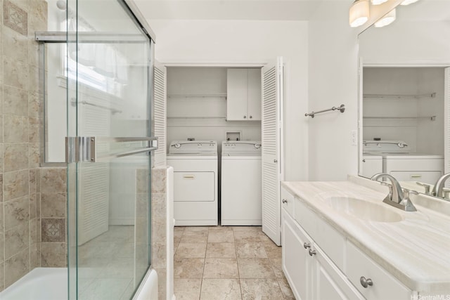622 Pamaele St, Kailua, HI 96734 - full bath with washer and clothes dryer, vanity, a closet, and combined bath / shower with glass door