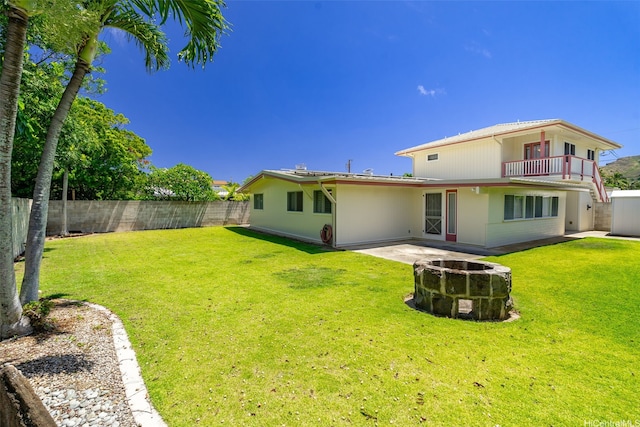 622 Pamaele St, Kailua, HI 96734 - rear view of house with an outdoor fire pit, a balcony, and a patio area