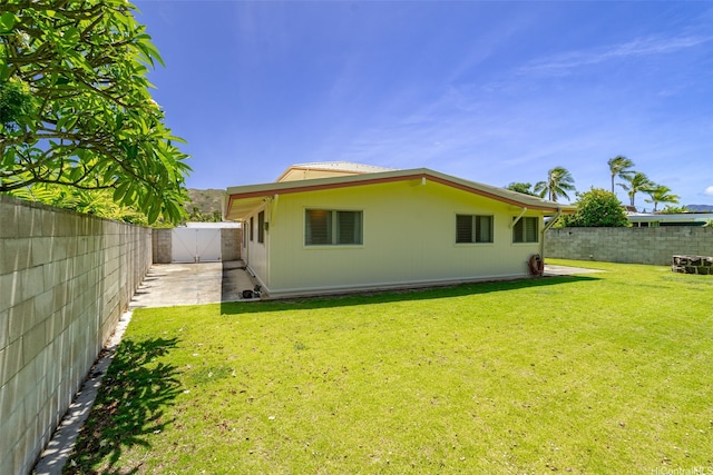 622 Pamaele St, Kailua, HI 96734 - rear view of house with a gate and a patio area