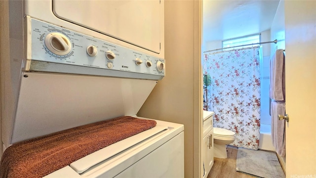 2122 Lime St Unit 307, Honolulu, HI 96826 - full bath with estacked washer and dryer, toilet, wood finished floors, and shower / bath combo