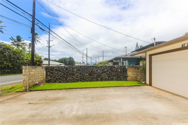 47-766 Kamehameha Hwy, Kaneohe, HI 96744 - garage featuring concrete driveway and fence