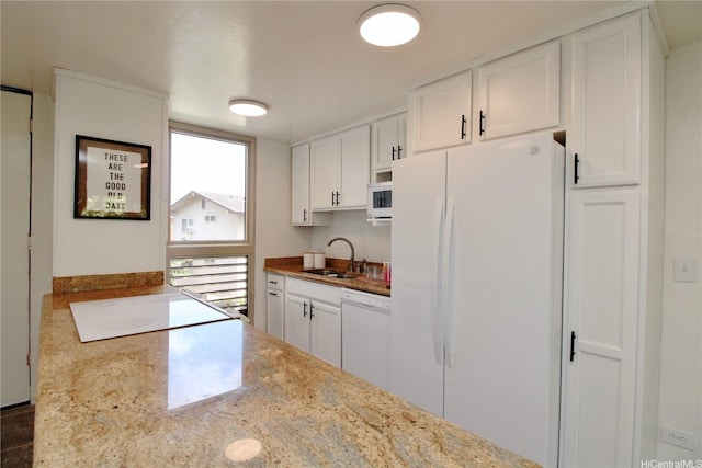 68-090 Au St Unit E312, Waialua, HI 96791 - kitchen with white appliances, white cabinets, and a sink