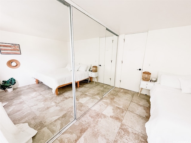 68-090 Au St Unit E312, Waialua, HI 96791 - unfurnished bedroom featuring light stone finish floors