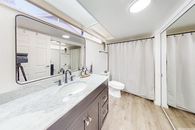 95-270 Waikalani Dr Unit L104, Mililani, HI 96789 - full bathroom with wood finished floors, vanity, and toilet