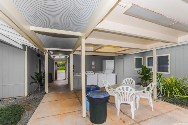 95-1050 Makaikai St Unit 23D, Mililani, HI 96789 - view of patio / terrace with outdoor dining area and separate washer and dryer