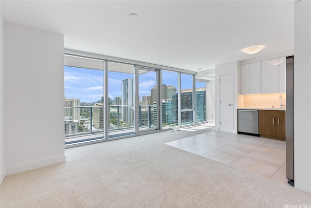 629 Keeaumoku St Unit 2103, Honolulu, HI 96814 - unfurnished living room with a sink, light carpet, floor to ceiling windows, a view of skyline, and light tile patterned flooring