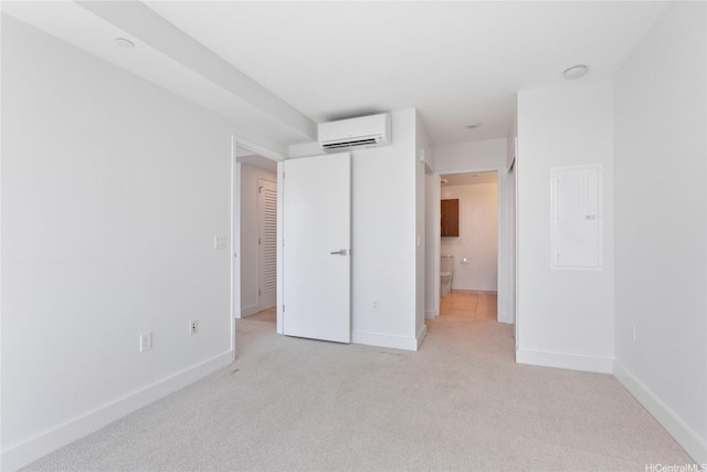 629 Keeaumoku St Unit 2103, Honolulu, HI 96814 - unfurnished bedroom featuring a wall unit AC, light carpet, baseboards, and electric panel