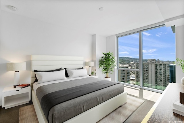 629 Keeaumoku St Unit 2103, Honolulu, HI 96814 - bedroom featuring expansive windows and a city view