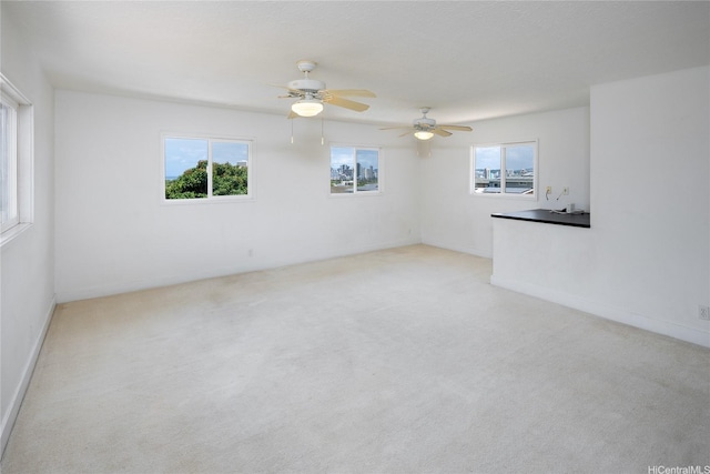 3453 Edna St, Honolulu, HI 96815 - carpeted spare room with plenty of natural light and a ceiling fan
