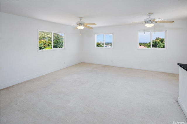 3453 Edna St, Honolulu, HI 96815 - spare room with plenty of natural light, light carpet, ceiling fan, and baseboards