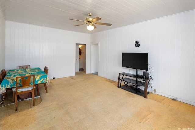 3453 Edna St, Honolulu, HI 96815 - sitting room with carpet flooring, a ceiling fan, and wood walls