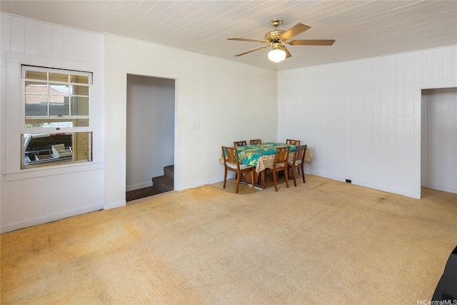 3453 Edna St, Honolulu, HI 96815 - carpeted dining area with a ceiling fan, baseboards, wood walls, and wood ceiling