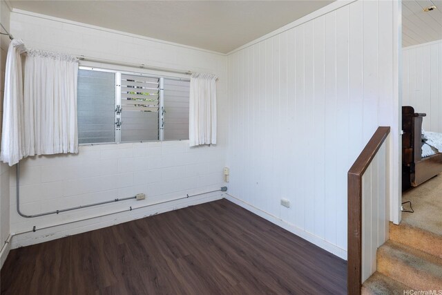 3453 Edna St, Honolulu, HI 96815 - empty room featuring dark wood-style flooring, baseboards, and crown molding