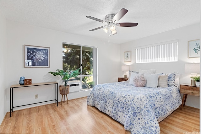 94-820 Lumiauau St Unit G201, Waipahu, HI 96797 - bedroom featuring wood finished floors, a textured ceiling, and a ceiling fan