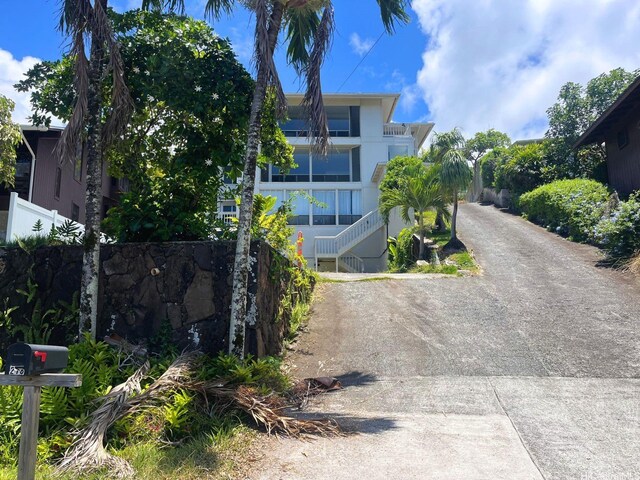 47-218 Kamehameha Hwy, Kaneohe, HI 96744 - view of front of house featuring dirt driveway and stairs