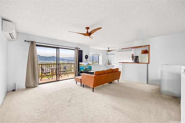 46-049 Aliianela Pl Unit 1713, Kaneohe, HI 96744 - living room with carpet floors, a wall mounted air conditioner, a textured ceiling, and a ceiling fan