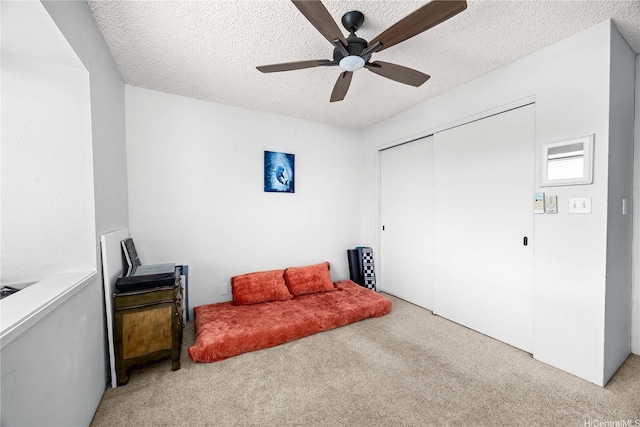 46-049 Aliianela Pl Unit 1713, Kaneohe, HI 96744 - sitting room featuring carpet floors, a textured ceiling, and ceiling fan