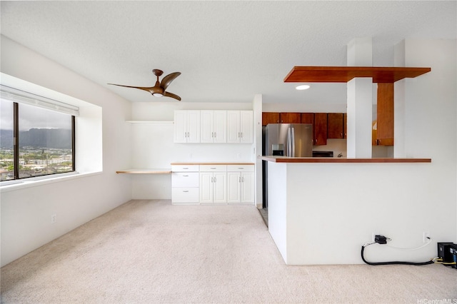 46-049 Aliianela Pl Unit 1713, Kaneohe, HI 96744 - kitchen with light carpet, stainless steel fridge, white cabinets, ceiling fan, and recessed lighting