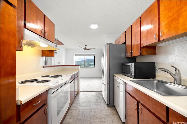 46-049 Aliianela Pl Unit 1713, Kaneohe, HI 96744 - kitchen featuring white appliances, under cabinet range hood, light countertops, and a textured ceiling