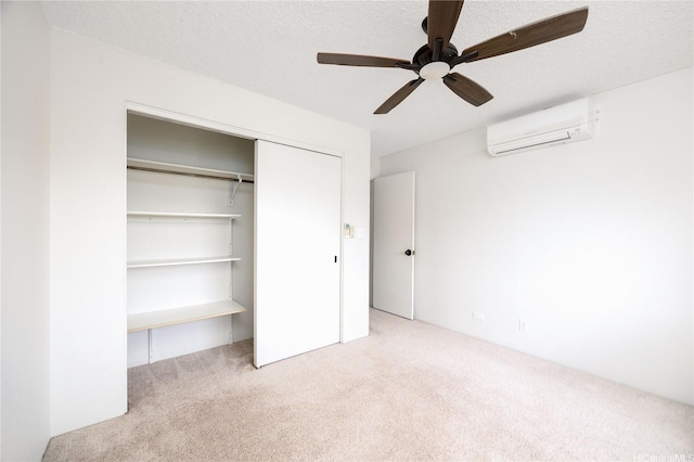 46-049 Aliianela Pl Unit 1713, Kaneohe, HI 96744 - unfurnished bedroom featuring a wall mounted air conditioner, carpet, a closet, and ceiling fan