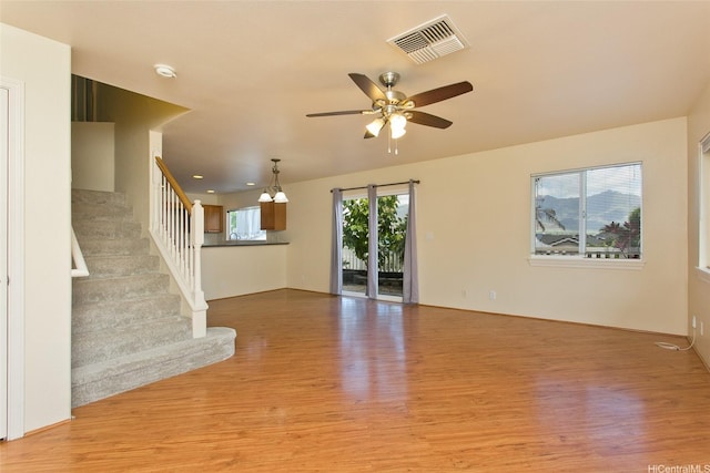 87-2233 Pakeke St, Waianae, HI 96792 - unfurnished living room featuring light wood-style floors, a ceiling fan, and stairway