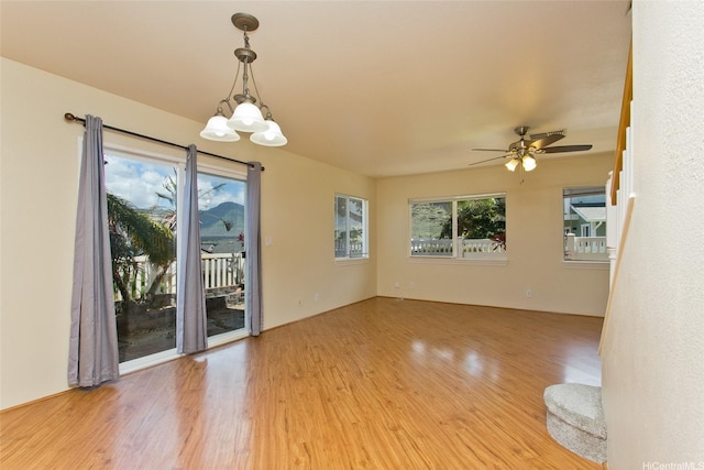 87-2233 Pakeke St, Waianae, HI 96792 - empty room with light wood-style flooring, ceiling fan, and a chandelier