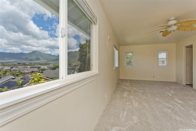 87-2233 Pakeke St, Waianae, HI 96792 - carpeted empty room featuring a mountain view and a ceiling fan