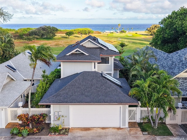 382 Kuanalu Pl, Honolulu, HI 96825 - view of front of property with roof with shingles, a gate, a water view, solar panels, and a garage