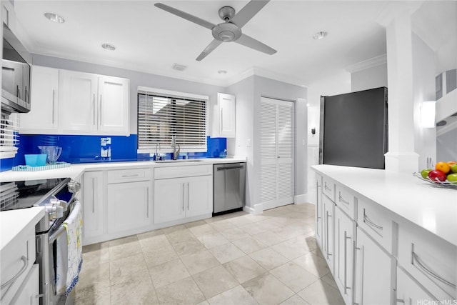 382 Kuanalu Pl, Honolulu, HI 96825 - kitchen with appliances with stainless steel finishes, a sink, backsplash, ceiling fan, and white cabinetry